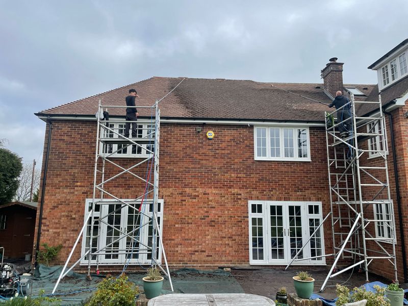 Roof cleaning carried out safely from scaffold towers by The Roof Moss Cleaners in Wroughton